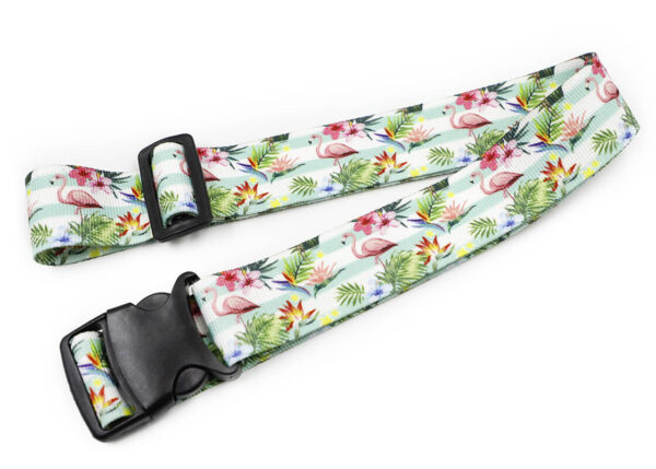 Stylish personalized luggage strap with a tropical flamingo design, combining vibrant colors and floral patterns for a chic and functional travel accessory. Made from high-quality ribbed polyester. AMGS Group.