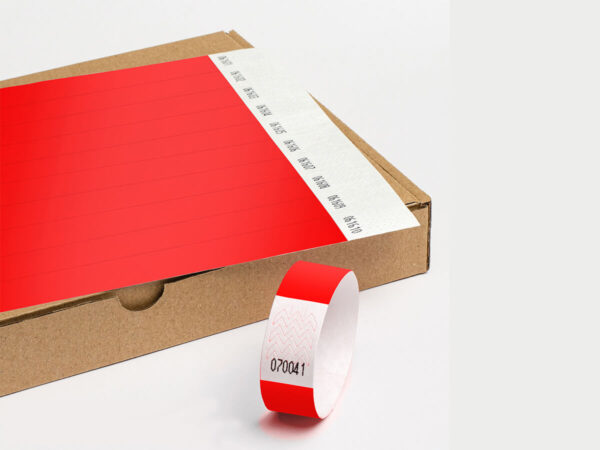 Red Tyvek wristbands supplied in sheets. Tear-resistant, hypoallergenic material by DuPont. Manufacturer AMGS Group.
