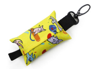View of a colorful, customizable dog poop bag holder with fun cat patterns and a durable hook.