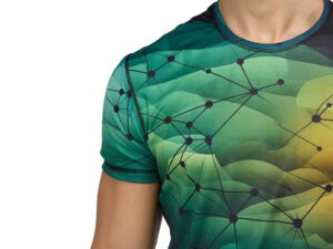 Close-up of a men’s sports T-shirt with dynamic sublimation print – a multicolor gradient in shades of green, yellow, and navy blue, featuring a graphic mesh connection pattern. Breathable fabric and neat finishes ensure comfort and a modern look. Available at AMGS Group.