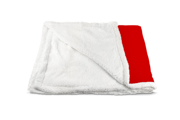 Folded sherpa blanket revealing the soft white plush lining and a section of the red microfiber printed side.