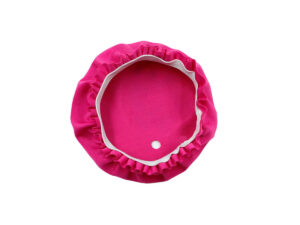 Inside view of a pink fabric cup lid showing the elastic band and reinforced straw hole.