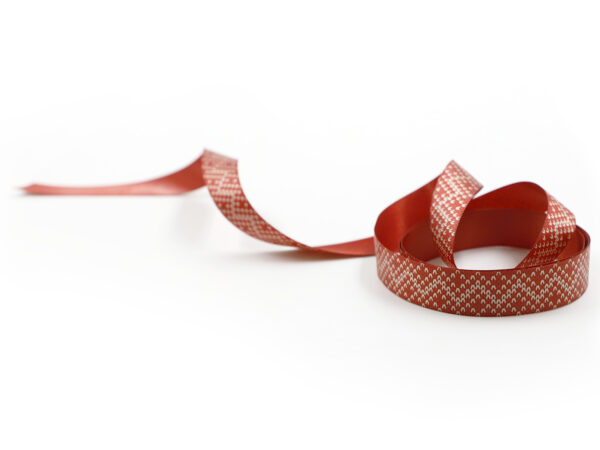 Elegant red ribbon with small white geometric pattern. Double-sided ribbon, ideal for B2B holiday decorations. Manufacturer AMGS Group.