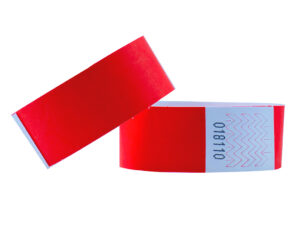 Wide red Tyvek wristband, 25mm. Bold color for security staff and access control. Manufacturer AMGS Group.
